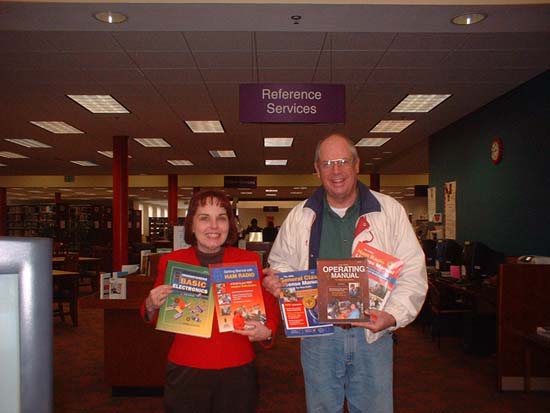 NFARL's Jim Stafford presents gift books to Ocoee Branch Library